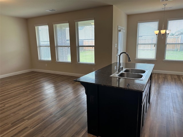 1206 Erika, Forney, TX 75126 - kitchen featuring dark wood finished floors, healthy amount of natural light, a center island with sink, and open floor plan