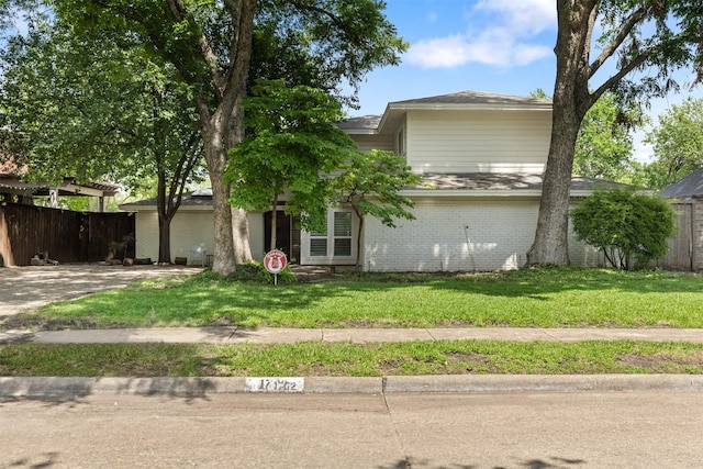 1702 Cheyenne Dr, Richardson, TX 75080 - view of front of property with brick siding and driveway