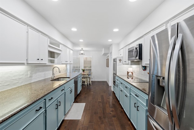 1702 Cheyenne Dr, Richardson, TX 75080 - kitchen with stainless steel appliances, open shelves, decorative backsplash, white cabinetry, and recessed lighting