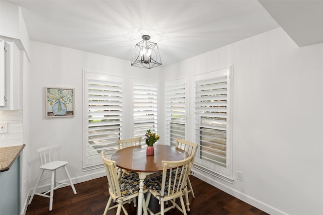 1702 Cheyenne Dr, Richardson, TX 75080 - dining space with a chandelier and dark wood-style flooring