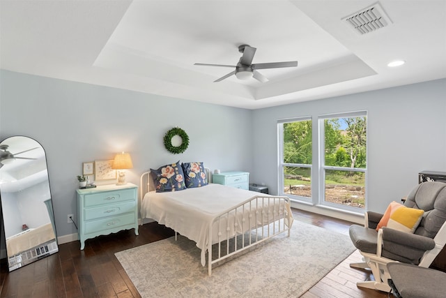 1702 Cheyenne Dr, Richardson, TX 75080 - bedroom featuring a tray ceiling, dark wood-style flooring, recessed lighting, and ceiling fan