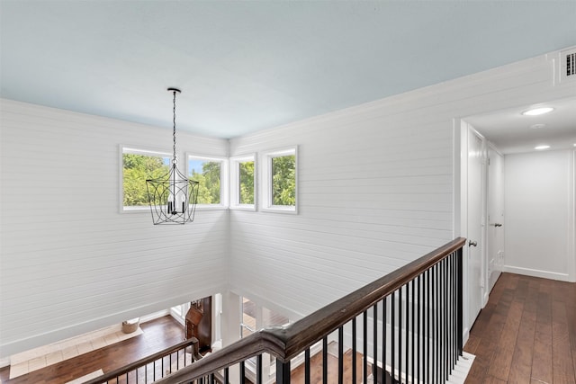 1702 Cheyenne Dr, Richardson, TX 75080 - corridor with a chandelier, dark wood-type flooring, and an upstairs landing