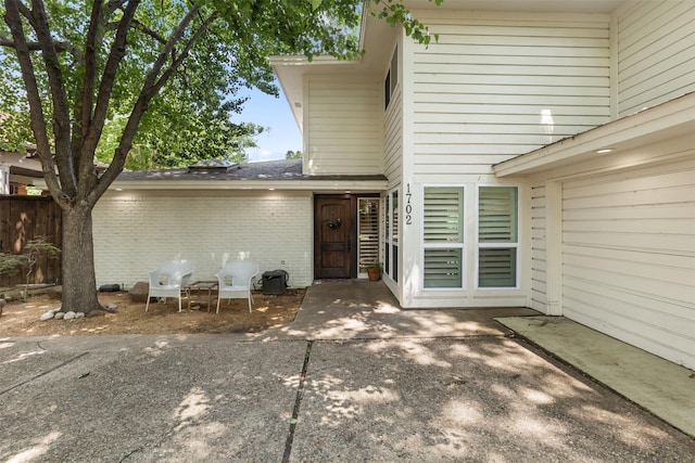 1702 Cheyenne Dr, Richardson, TX 75080 - back of property with a patio and brick siding