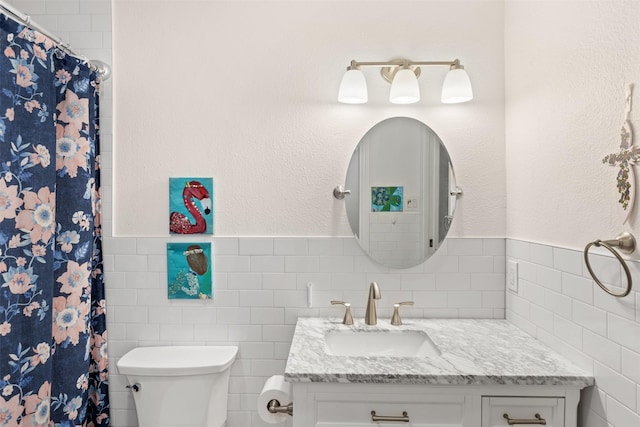 1702 Cheyenne Dr, Richardson, TX 75080 - full bathroom with tile walls, vanity, and curtained shower