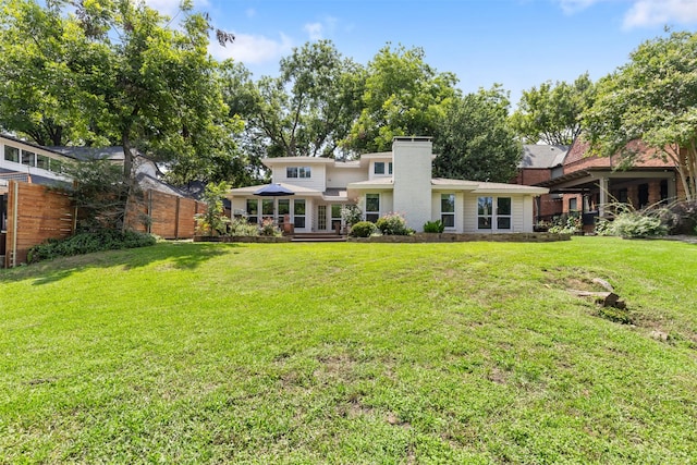 1702 Cheyenne Dr, Richardson, TX 75080 - back of property featuring a chimney