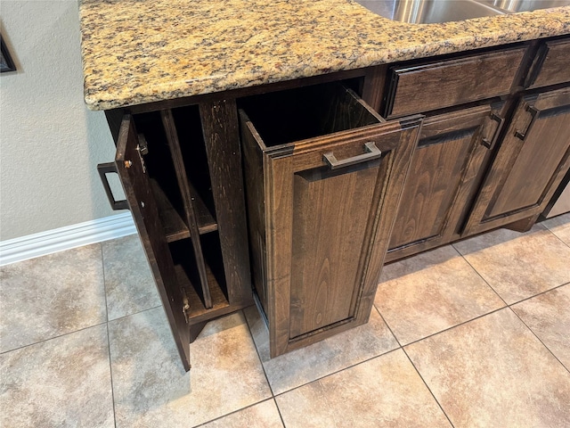 105 Windsor Dr, Forney, TX 75126 - kitchen view of dark brown cabinets and light stone counters