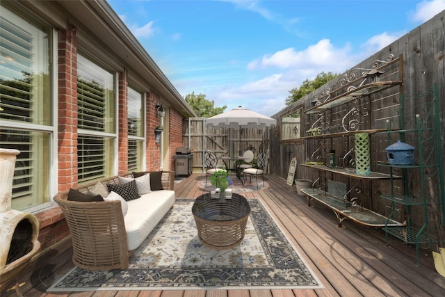 105 Windsor Dr, Forney, TX 75126 - wooden terrace with grilling area and an outdoor living space