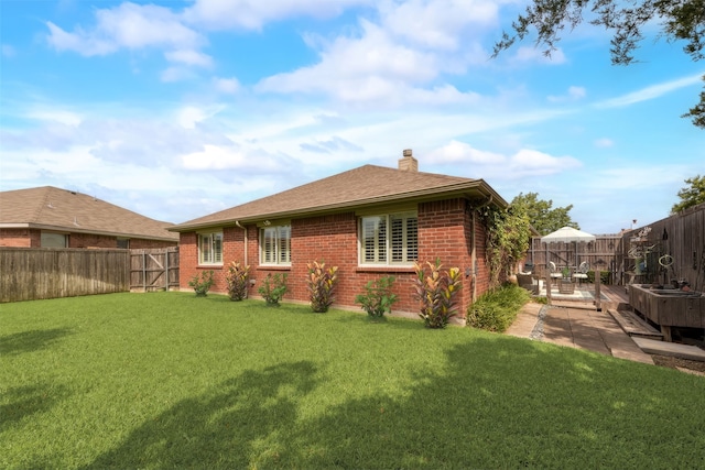 105 Windsor Dr, Forney, TX 75126 - back of house with a fenced backyard, a chimney, brick siding, a patio, and a shingled roof