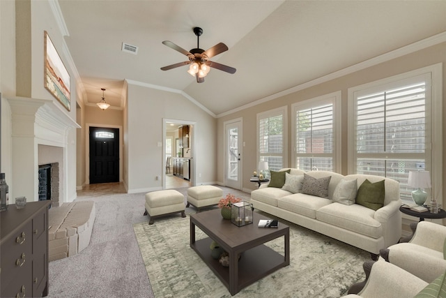 105 Windsor Dr, Forney, TX 75126 - carpeted living area featuring ceiling fan, crown molding, lofted ceiling, and a fireplace