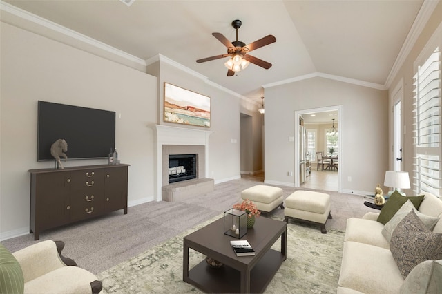 105 Windsor Dr, Forney, TX 75126 - living area featuring a ceiling fan, carpet floors, ornamental molding, a fireplace with raised hearth, and lofted ceiling