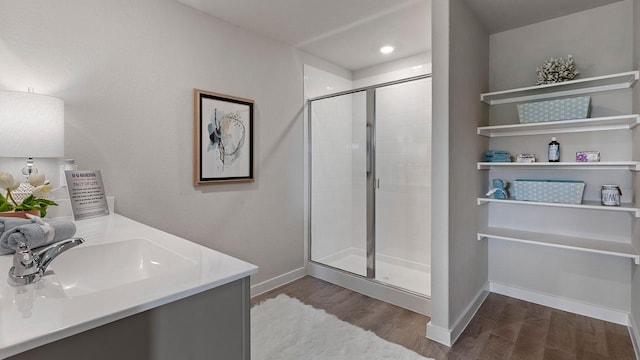1525 Central Park Dr, Alvarado, TX 76009 - full bathroom featuring wood finished floors, a shower stall, and vanity