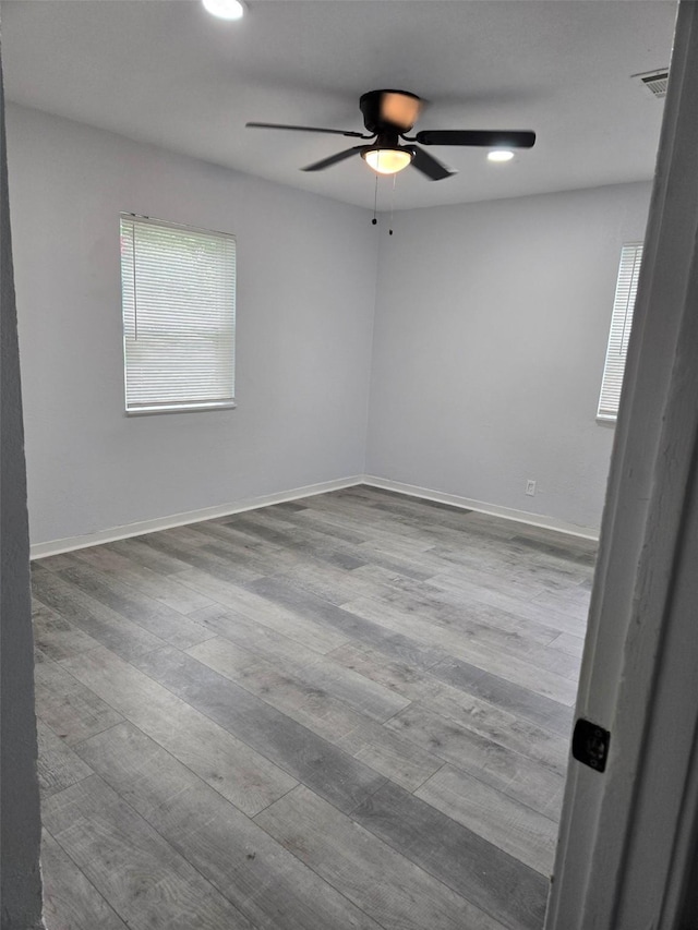 810 Shawnee Trce, Grand Prairie, TX 75051 - spare room with ceiling fan, wood finished floors, and recessed lighting