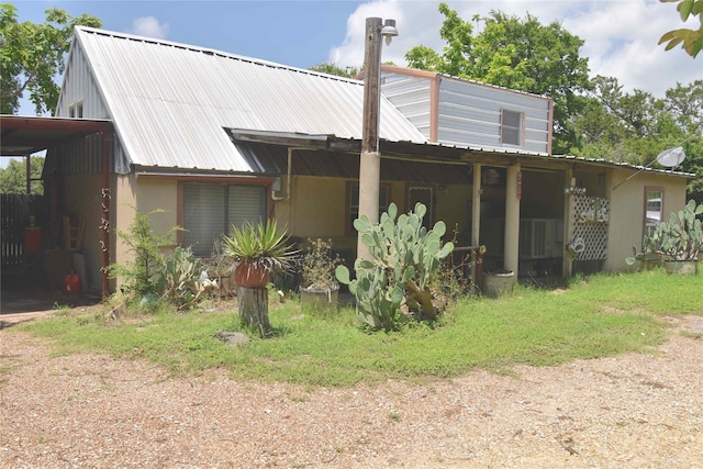 103 One Feather, Whitney, TX 76692 - rear view of property featuring a metal roof
