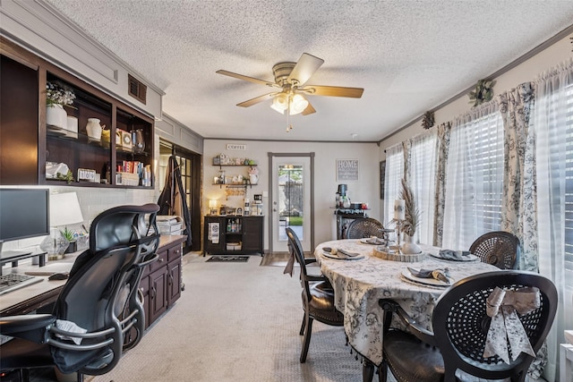 3244 Gail Ct, Irving, TX 75060 - dining room featuring a ceiling fan, an office area, light carpet, and a textured ceiling