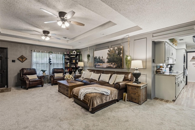 3244 Gail Ct, Irving, TX 75060 - bedroom with a tray ceiling, a textured ceiling, and light carpet