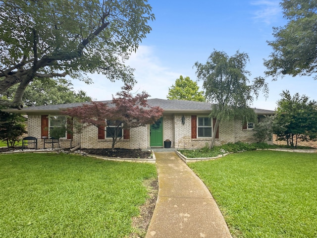 312 Meadowlark Dr, Richardson, TX 75080 - ranch-style house featuring brick siding and a front yard