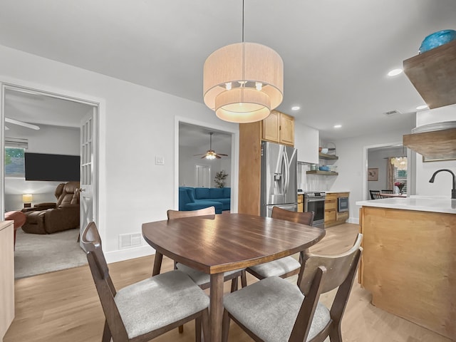312 Meadowlark Dr, Richardson, TX 75080 - dining space featuring light wood finished floors, recessed lighting, and ceiling fan