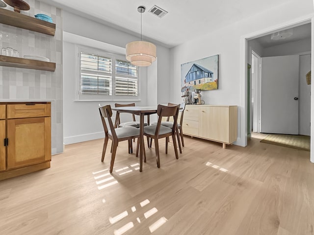312 Meadowlark Dr, Richardson, TX 75080 - dining area featuring light wood-style floors and baseboards