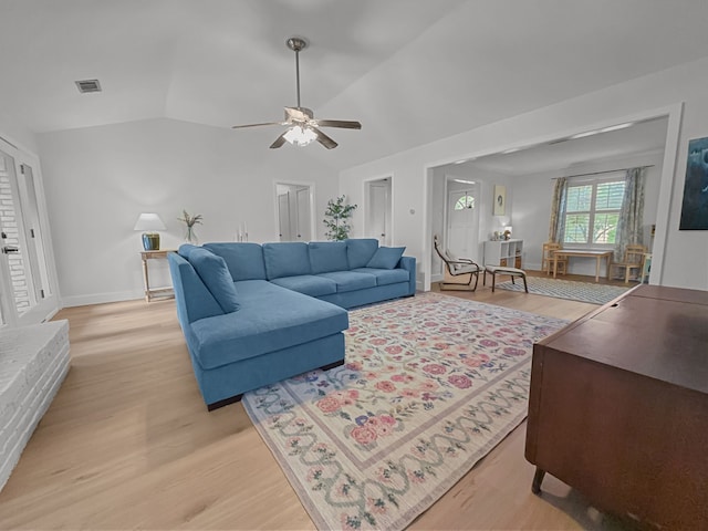 312 Meadowlark Dr, Richardson, TX 75080 - living area with light wood-type flooring, ceiling fan, and vaulted ceiling