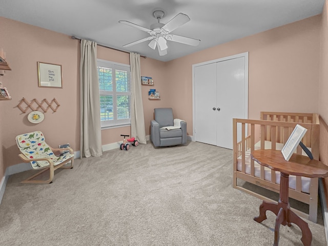 312 Meadowlark Dr, Richardson, TX 75080 - bedroom with carpet, a ceiling fan, a closet, and a crib