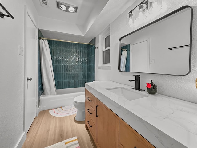 312 Meadowlark Dr, Richardson, TX 75080 - full bath with vanity, wood finished floors, and shower / bath combo