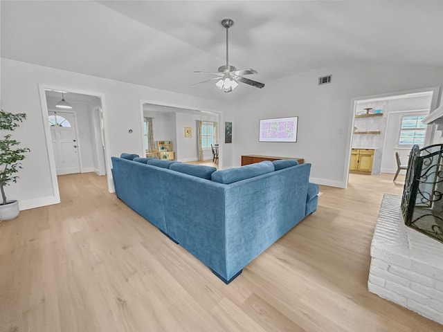312 Meadowlark Dr, Richardson, TX 75080 - living room with lofted ceiling, light wood finished floors, and ceiling fan