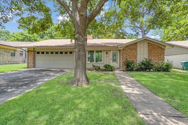 2909 Dover Dr, Sherman, TX 75092 - view of front of home featuring brick siding, an attached garage, driveway, and a front lawn