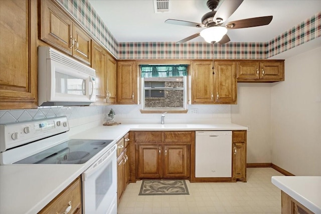 2909 Dover Dr, Sherman, TX 75092 - kitchen with white appliances, brown cabinetry, a ceiling fan, backsplash, and light countertops