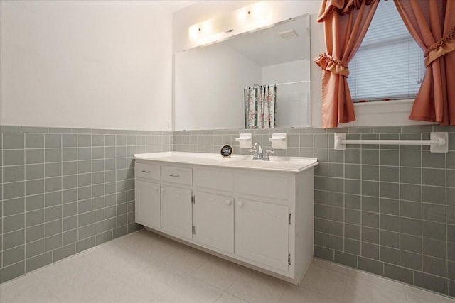 2909 Dover Dr, Sherman, TX 75092 - full bathroom with tile walls, vanity, a wainscoted wall, tile patterned floors, and a shower with shower curtain