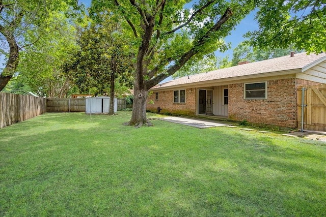 2909 Dover Dr, Sherman, TX 75092 - fenced backyard featuring a storage unit