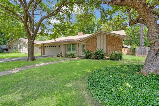 2909 Dover Dr, Sherman, TX 75092 - view of front of house with brick siding, a chimney, board and batten siding, an attached garage, and driveway