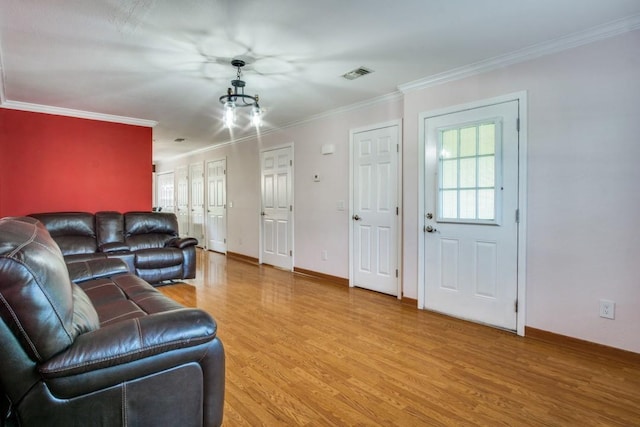 902 Travis Ave, Alvarado, TX 76009 - living room with light wood finished floors, plenty of natural light, and ornamental molding