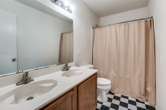 2007 Brazos Ct, Grand Prairie, TX 75052 - full bath featuring tile patterned floors, double vanity, and a textured ceiling