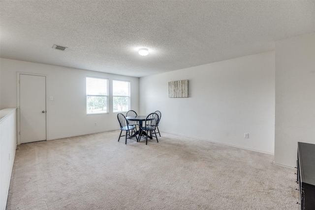 2007 Brazos Ct, Grand Prairie, TX 75052 - carpeted dining area featuring a textured ceiling