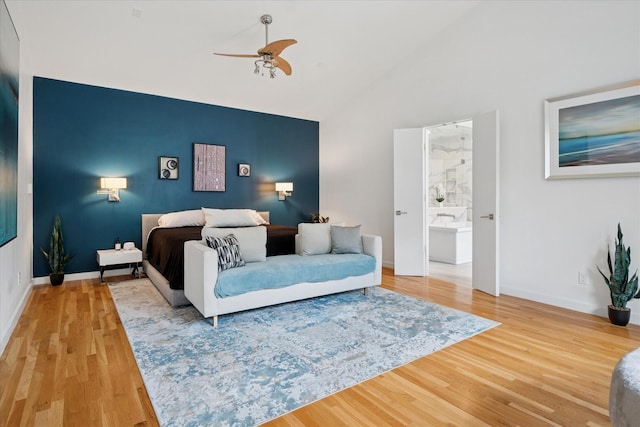 613 N Bailey Ave, Fort Worth, TX 76107 - bedroom with wood finished floors, high vaulted ceiling, ceiling fan, and ensuite bath