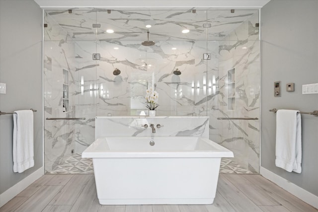 613 N Bailey Ave, Fort Worth, TX 76107 - full bath featuring a freestanding tub and a marble finish shower