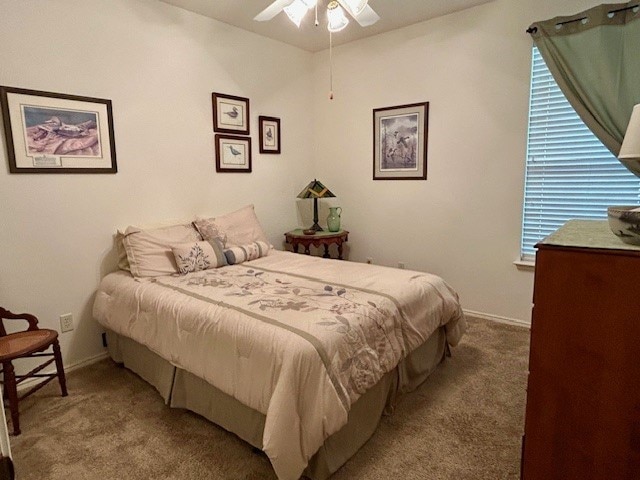 3900 Chimney Rock Dr, Denton, TX 76210 - carpeted bedroom with a ceiling fan and baseboards
