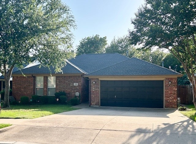 3900 Chimney Rock Dr, Denton, TX 76210 - ranch-style home with driveway, a garage, and brick siding