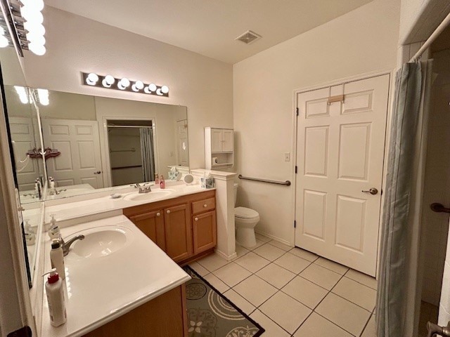 3900 Chimney Rock Dr, Denton, TX 76210 - bathroom with tile patterned flooring, vanity, and curtained shower