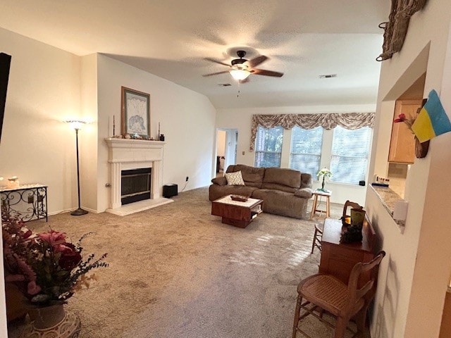 3900 Chimney Rock Dr, Denton, TX 76210 - carpeted living room featuring a ceiling fan and a fireplace with raised hearth