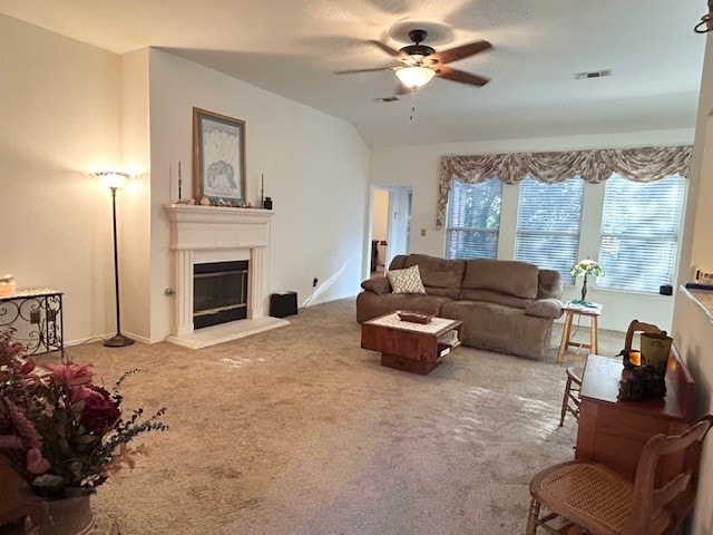 3900 Chimney Rock Dr, Denton, TX 76210 - carpeted living area with a ceiling fan and a glass covered fireplace