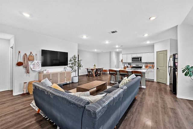 2806 Peony Dr, Sherman, TX 75092 - living area featuring dark wood-type flooring and recessed lighting