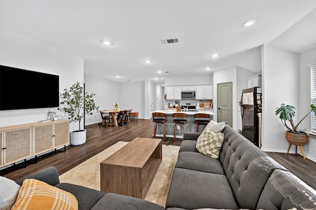 2806 Peony Dr, Sherman, TX 75092 - living area with recessed lighting and wood finished floors