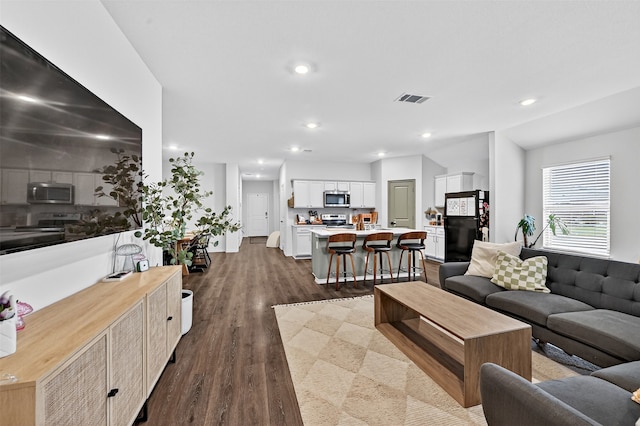 2806 Peony Dr, Sherman, TX 75092 - living room with dark wood-type flooring and recessed lighting