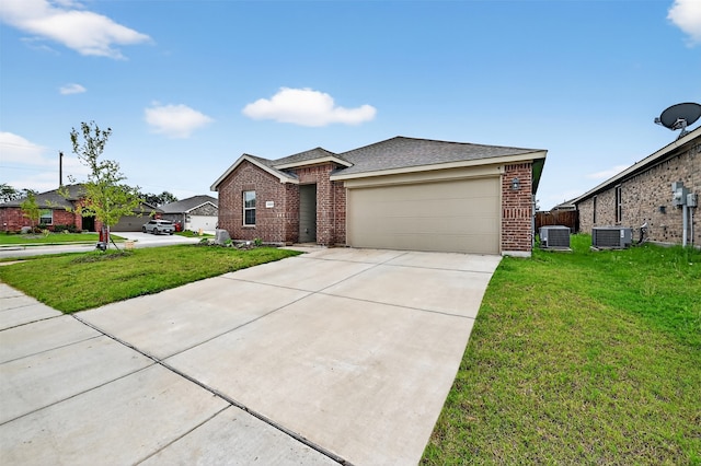 2806 Peony Dr, Sherman, TX 75092 - view of front facade with brick siding, an attached garage, a front yard, and concrete driveway