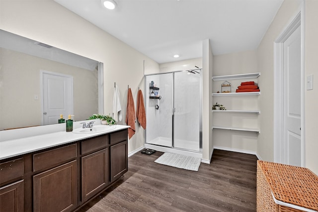 2806 Peony Dr, Sherman, TX 75092 - bathroom with a shower stall, vanity, wood finished floors, and recessed lighting