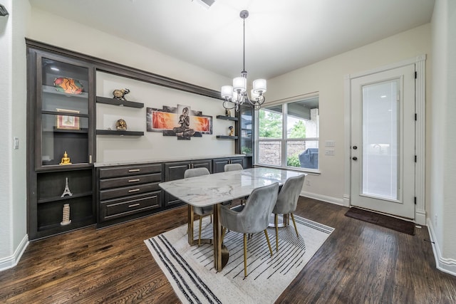 13122 Dolomite Dr, Frisco, TX 75035 - dining room featuring dark wood-type flooring and a chandelier