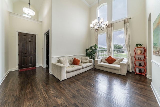 13122 Dolomite Dr, Frisco, TX 75035 - entrance foyer featuring a towering ceiling, a chandelier, and dark wood-style flooring