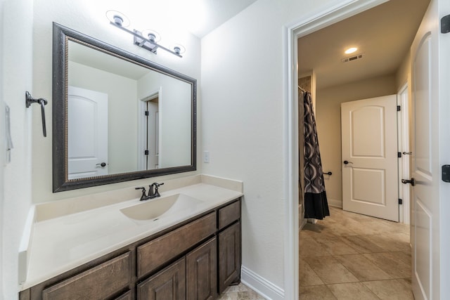 13122 Dolomite Dr, Frisco, TX 75035 - bathroom with vanity, a shower with shower curtain, and tile patterned flooring
