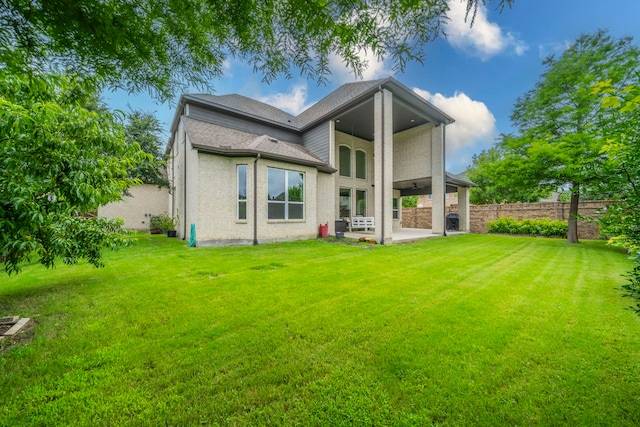 13122 Dolomite Dr, Frisco, TX 75035 - back of house featuring a patio, brick siding, and a shingled roof